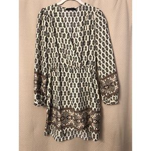 Black and cream pattern faux-wrap dress